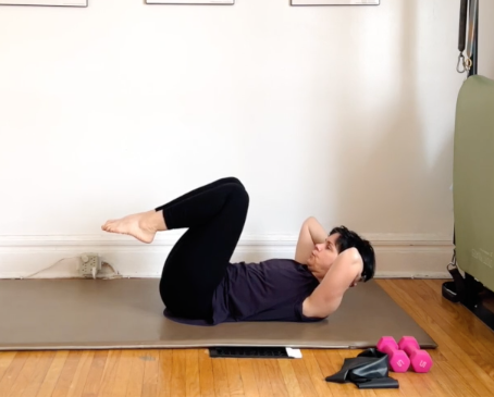 Pilates class with band and weights